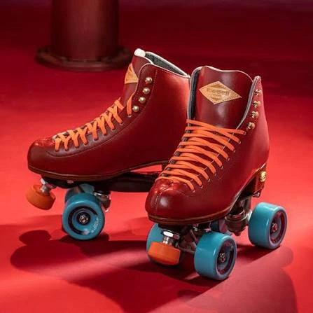 Burgundy quad roller skates with orange laces and blue wheels